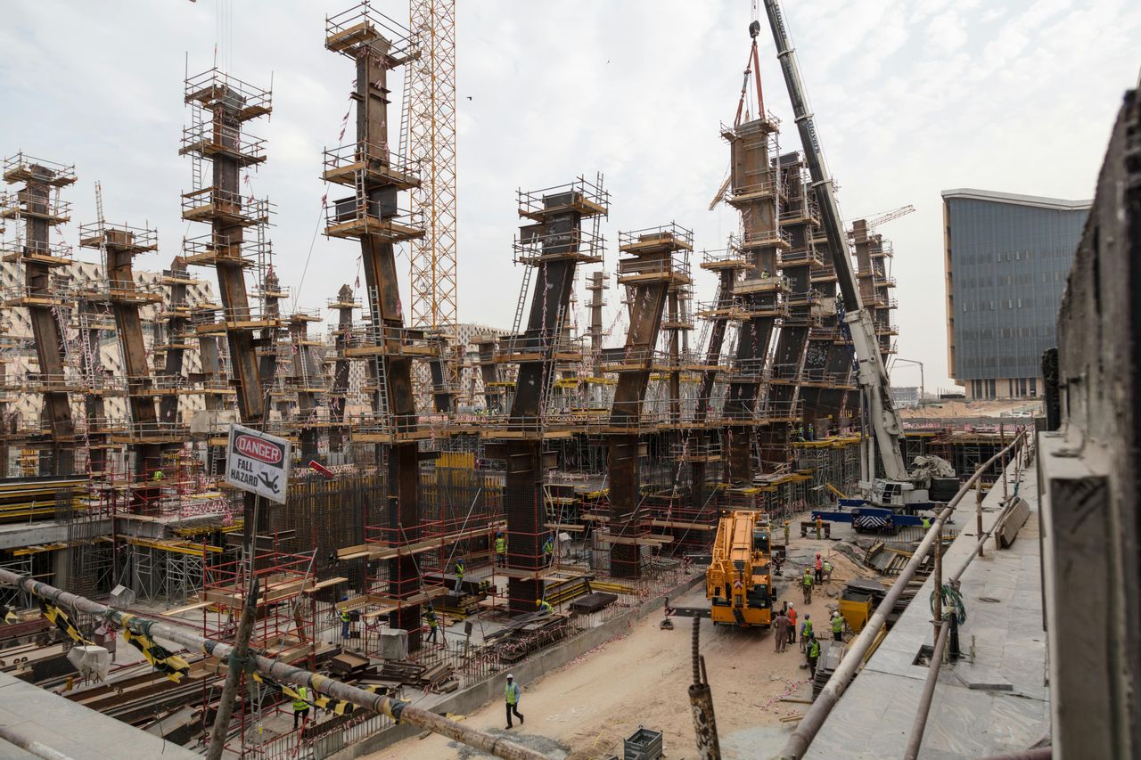 High-rise construction site with steel and concrete pillars